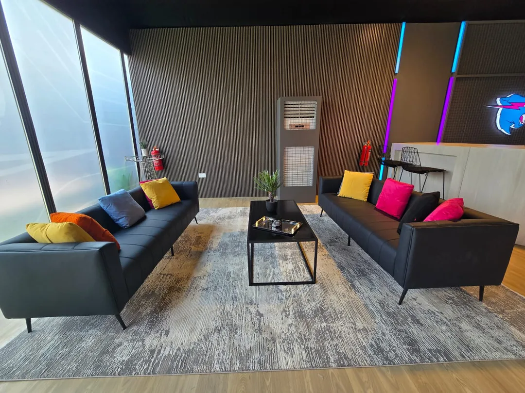 Elegant lounge seating with decorative cushions complementing the event colour palette.