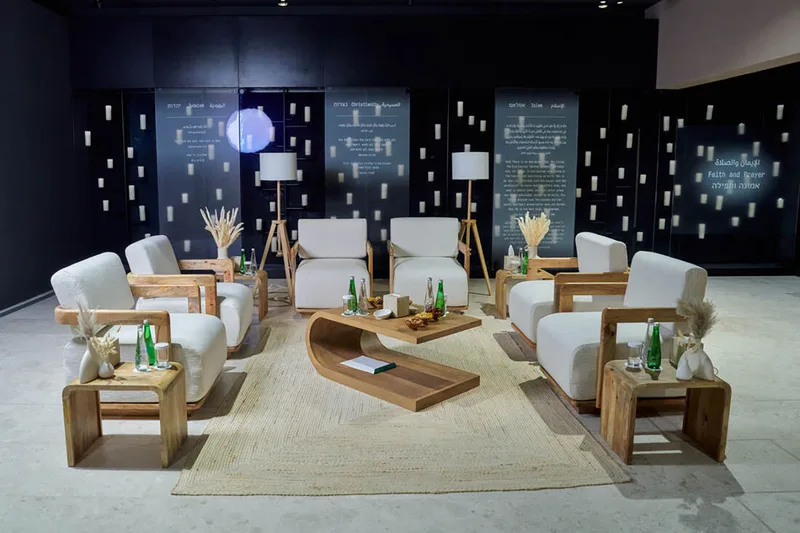 Human Fraternity Majlis furnished with elegant lounge seating and coordinated accessories.
