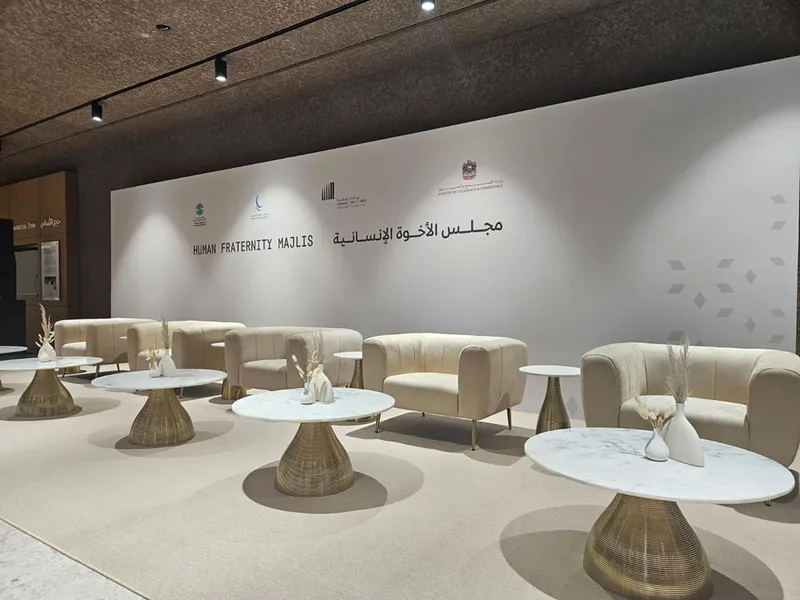 Evolution Furniture coffee tables, rugs and sofas forming a cohesive Majlis layout.