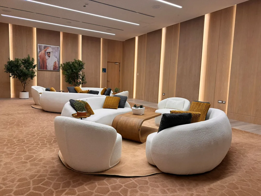Sofas and coffee tables creating a welcoming event lounge for guests.