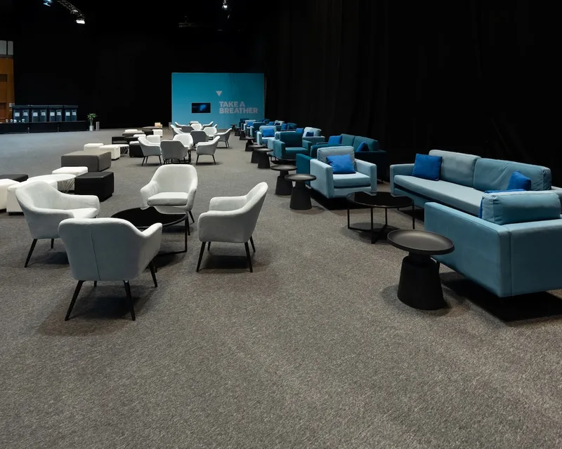 Flexible event lounge designed to transition from daytime networking to evening hospitality.