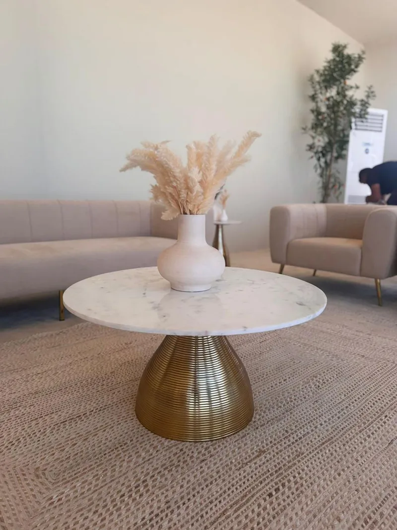 Evolution Furniture supplied marble coffee tables and luxury seating for UAE ERF hospitality areas.