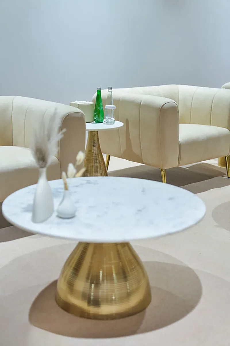 Carefully styled Majlis lounge featuring neutral upholstery, rugs and decorative vases.
