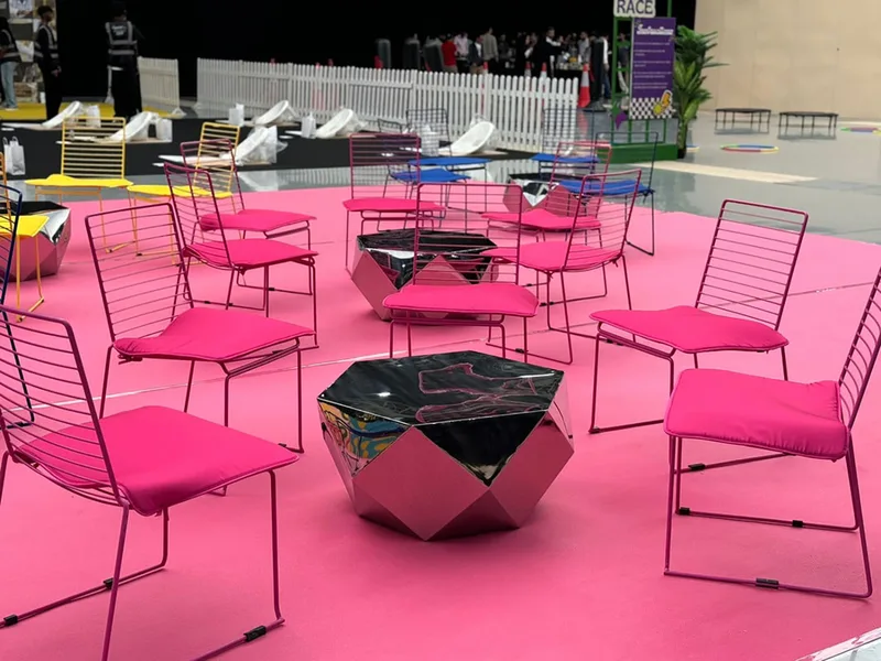Bright hospitality lounge layout with mixed-colour contemporary furniture.