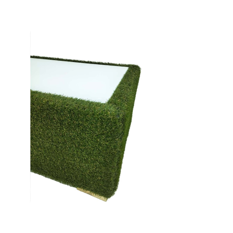 F-CT121-GS Eden coffee table finished in artificial grass with dark wooden feet and glass top