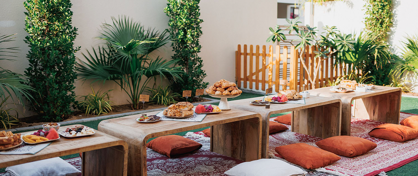 Coordinated lounge furniture transforming a residential garden into a hospitality venue
