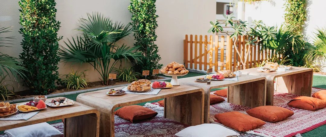 Coordinated lounge furniture transforming a residential garden into a hospitality venue