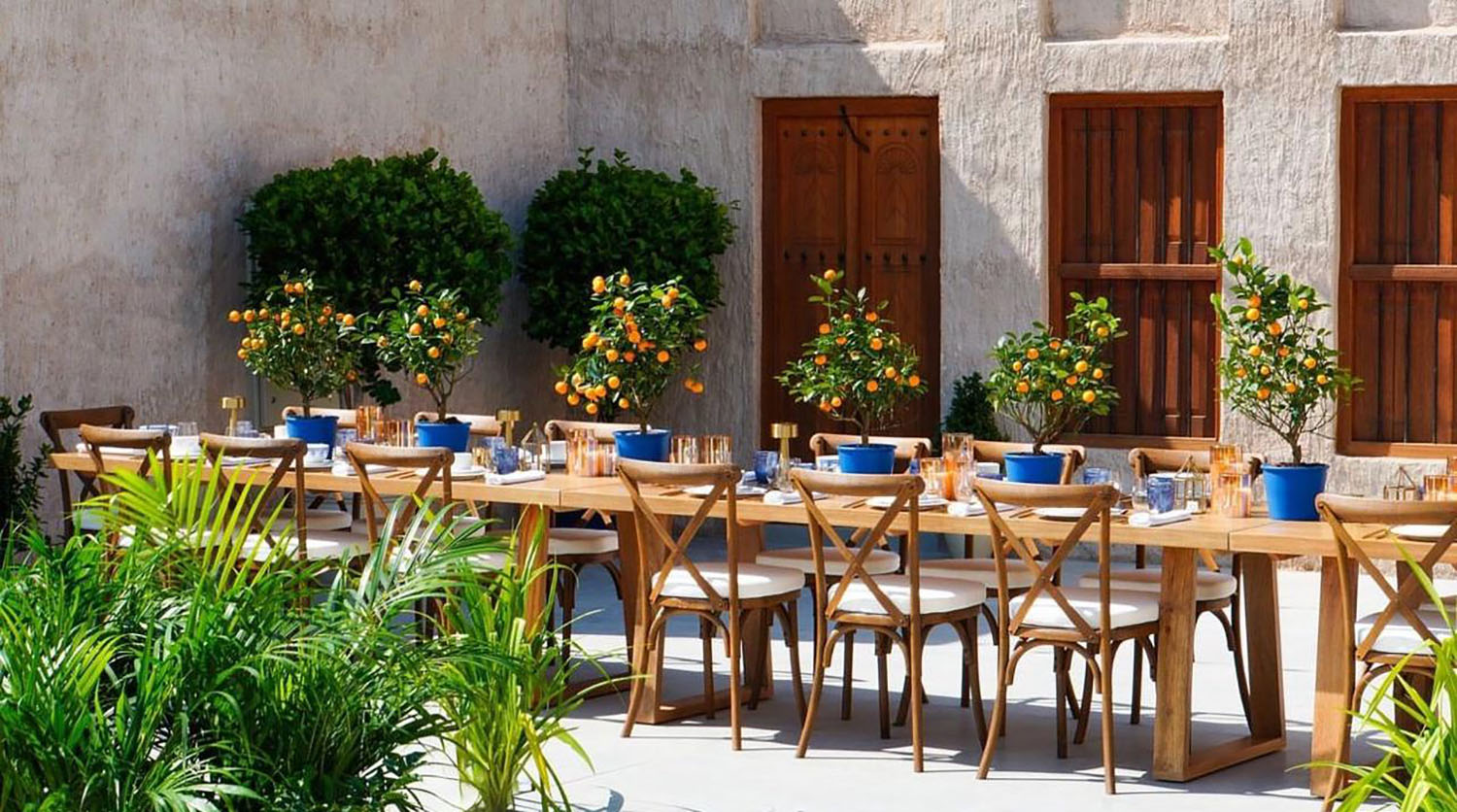 Evolution Furniture outdoor dining furniture installation for Sikka Art Festival in Al Bastakiya, Dubai.