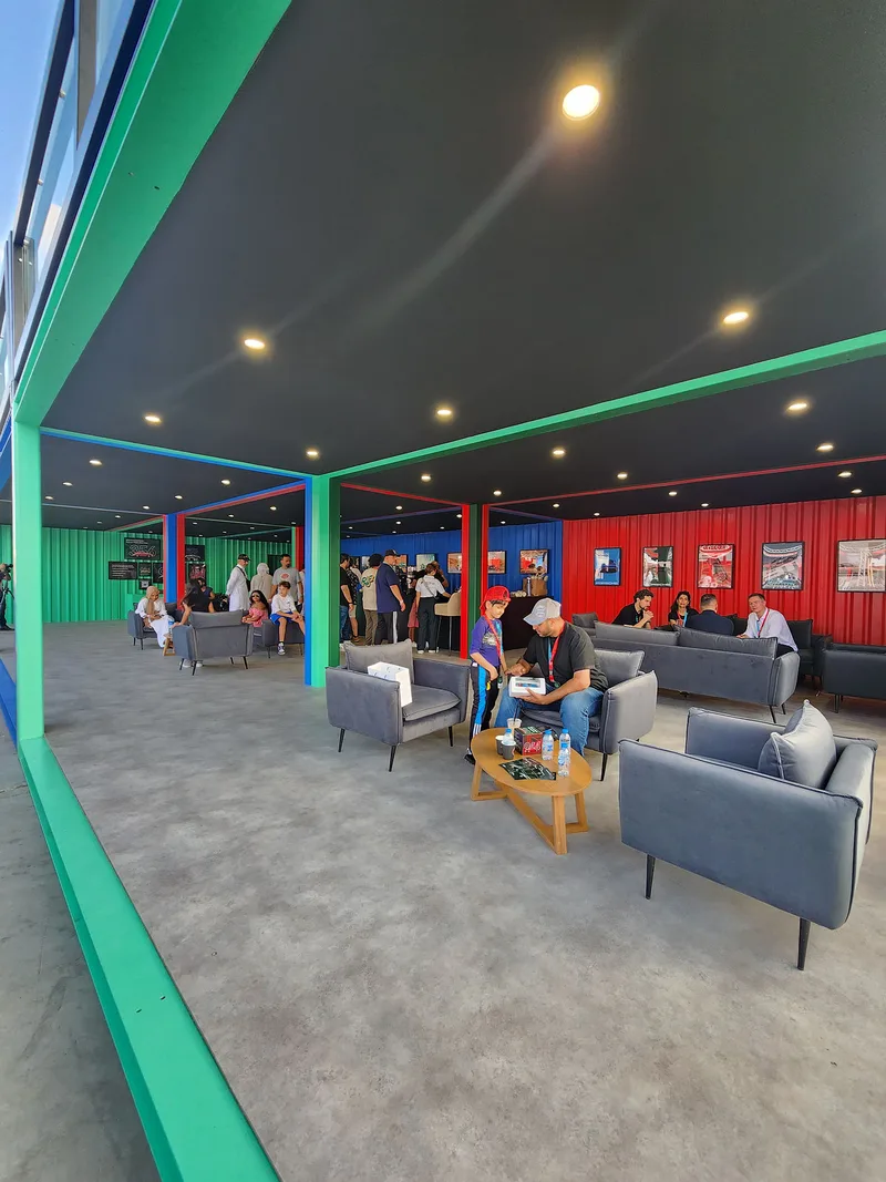 Soft seating and lounge furniture arranged for informal networking during Icons of Porsche 2023.