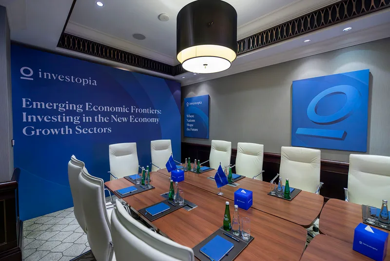 Executive meeting environment furnished with contemporary hospitality furniture and soft seating.