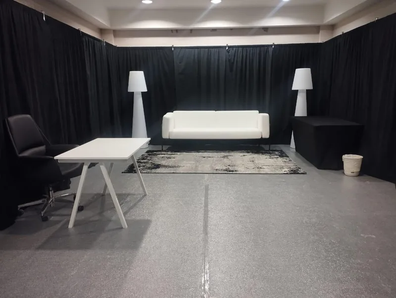Harvey white leather sofas and Murphy armchairs furnished backstage hospitality lounge at Dubai Rugby Sevens.
