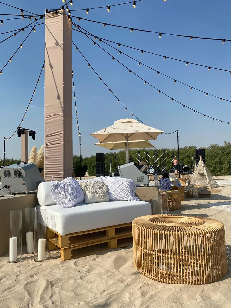 Premium event furniture positioned within a bespoke outdoor hospitality environment in Abu Dhabi.