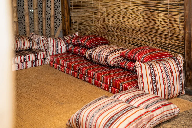 Arabic majlis seating with patterned cushions supplied for visitor hospitality spaces.