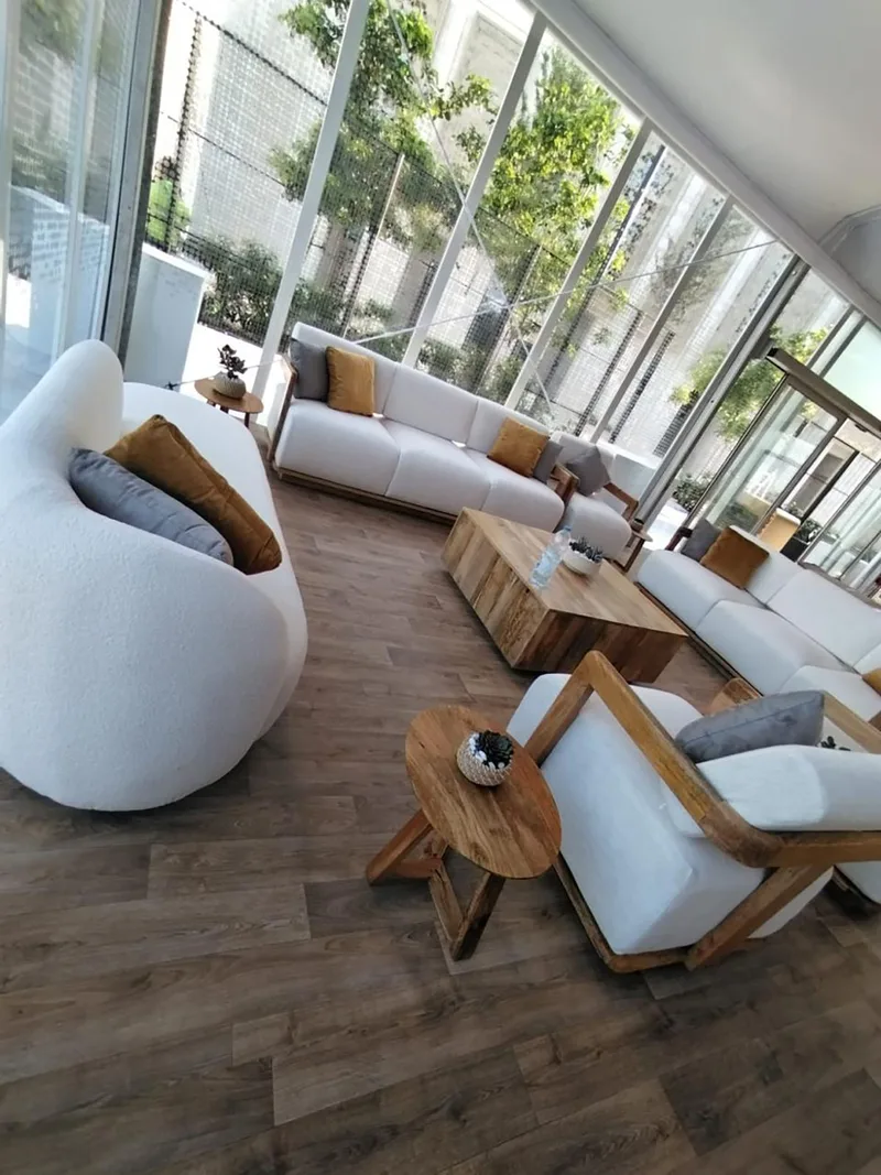 Bespoke hospitality environment featuring elegant sofas, side tables and coffee tables.