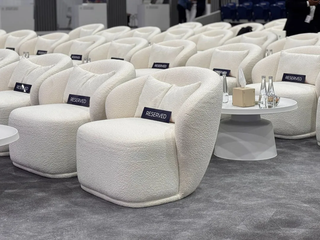 Lounge chair positioned within a stylish networking area.