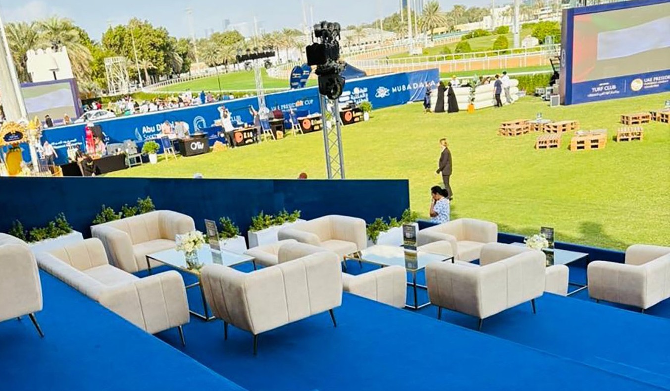 Cream upholstered VIP seating with gold accent tables supplied by Evolution Furniture in Abu Dhabi.