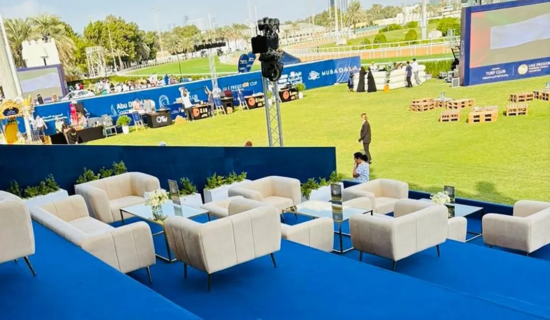 Cream upholstered VIP seating with gold accent tables supplied by Evolution Furniture in Abu Dhabi.