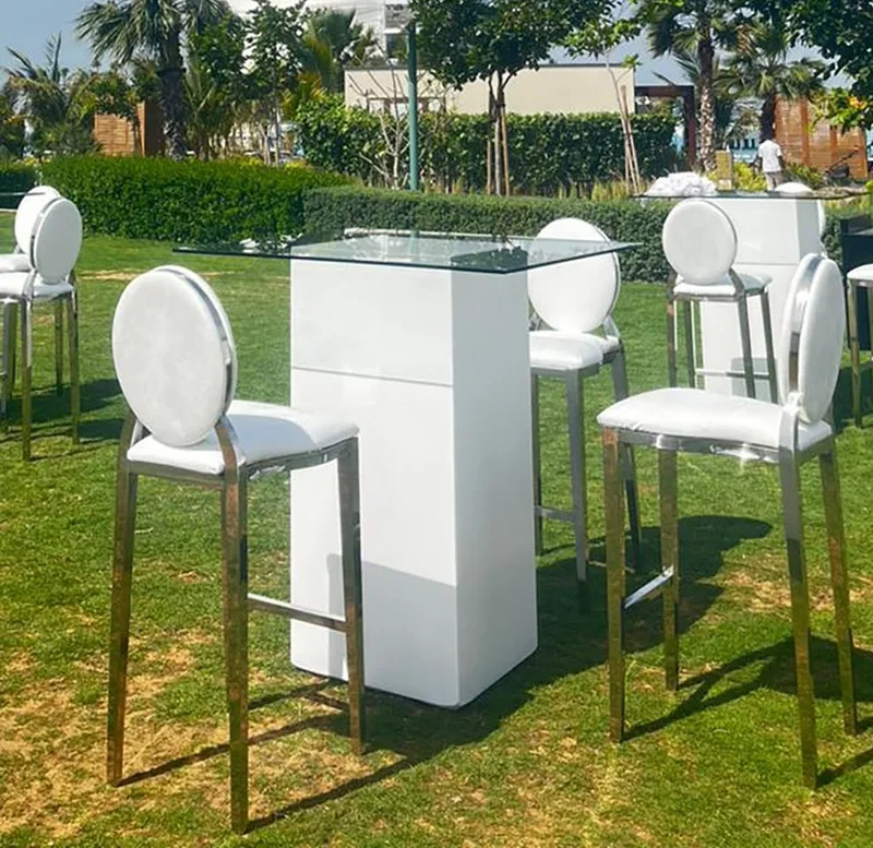 Elegant event plinths and premium furniture creating cohesive hospitality styling.