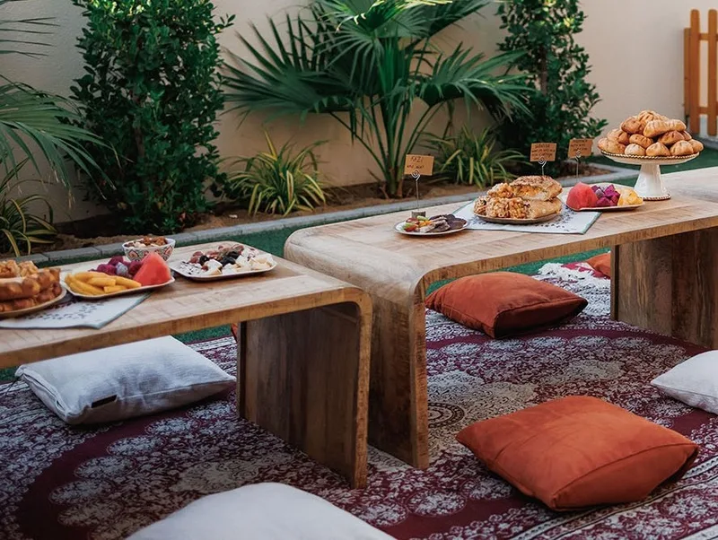 Decorative rugs and cushions adding warmth to a temporary hospitality environment