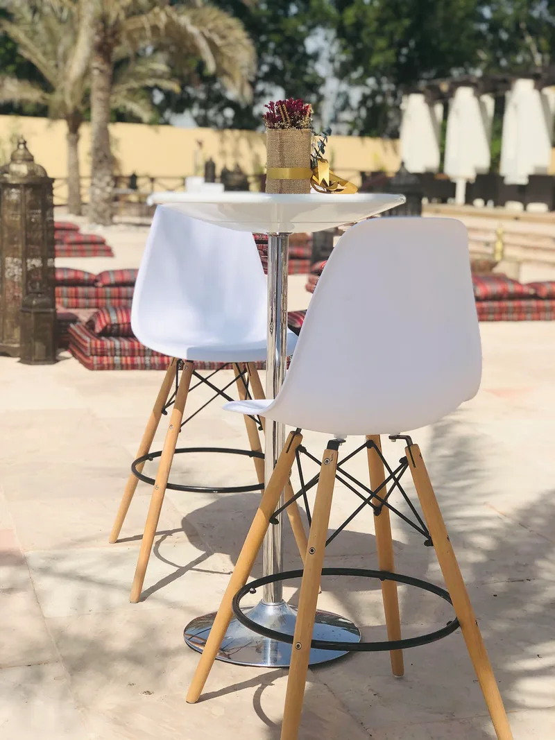 Coordinated event furniture creating stylish outdoor networking and relaxation spaces during Ramadan.