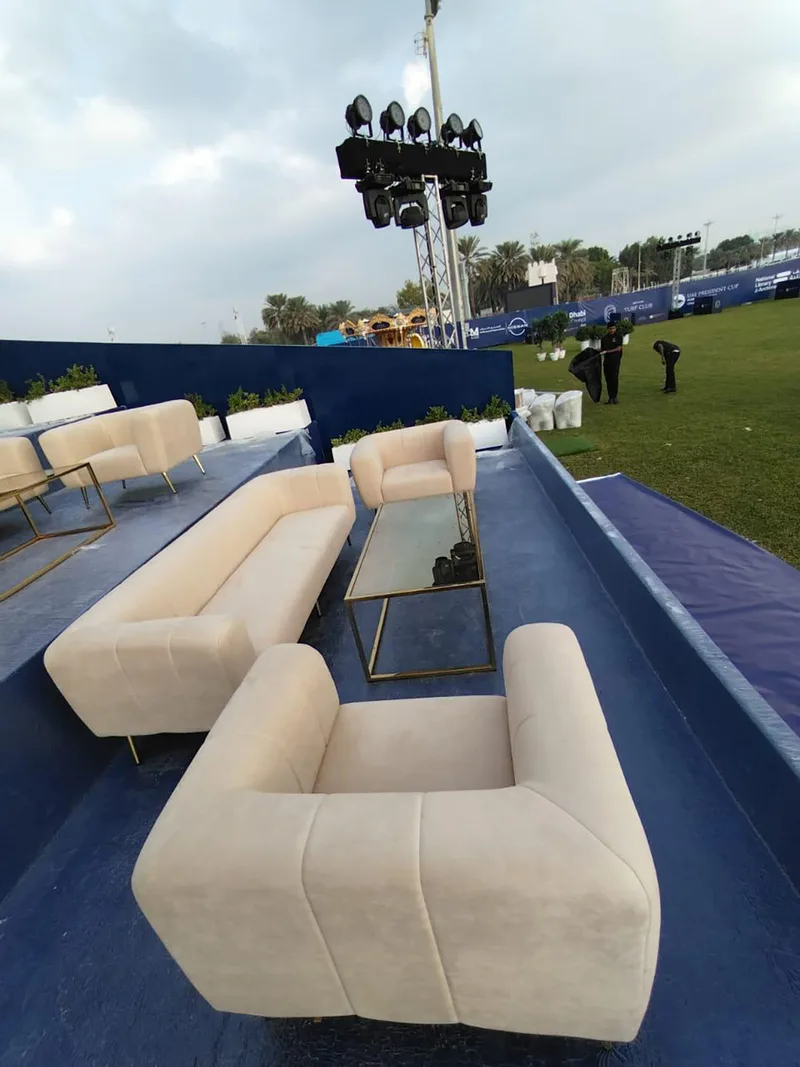 Premium Audrey sofas and champagne gold coffee tables creating an elegant VIP hospitality lounge.