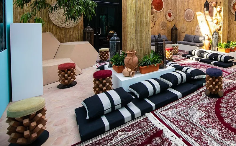 Stylish lounge furniture integrated into a premium temporary interior at Manarat Al Saadiyat.