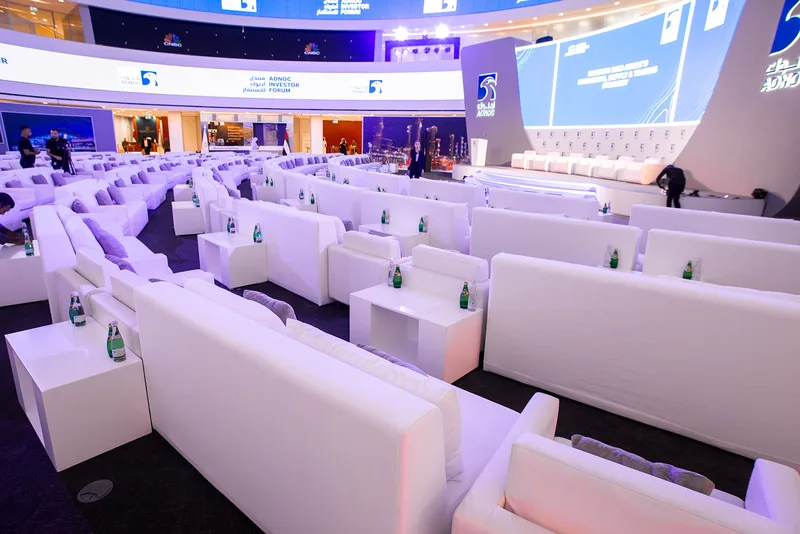 White upholstered seating creating a refined temporary hospitality environment in Abu Dhabi.