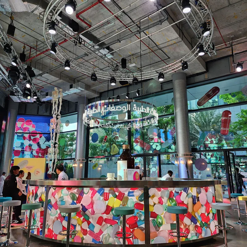 Custom furniture layouts creating welcoming hospitality environments for Prada Mode Dubai 2022.