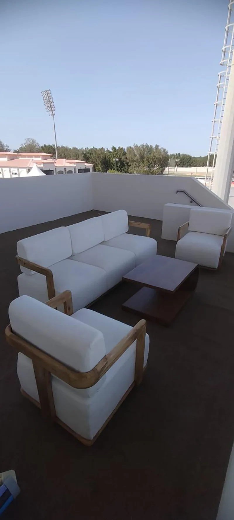 Outdoor hospitality lounge overlooking the equestrian arena with premium event furniture.