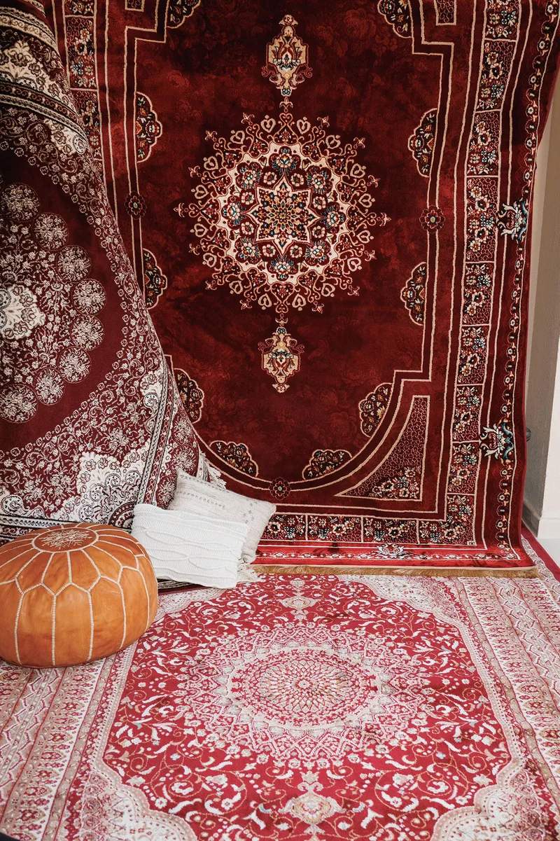Tatar-inspired outdoor furniture layout with traditional rugs and floor cushions at Mira Oasis