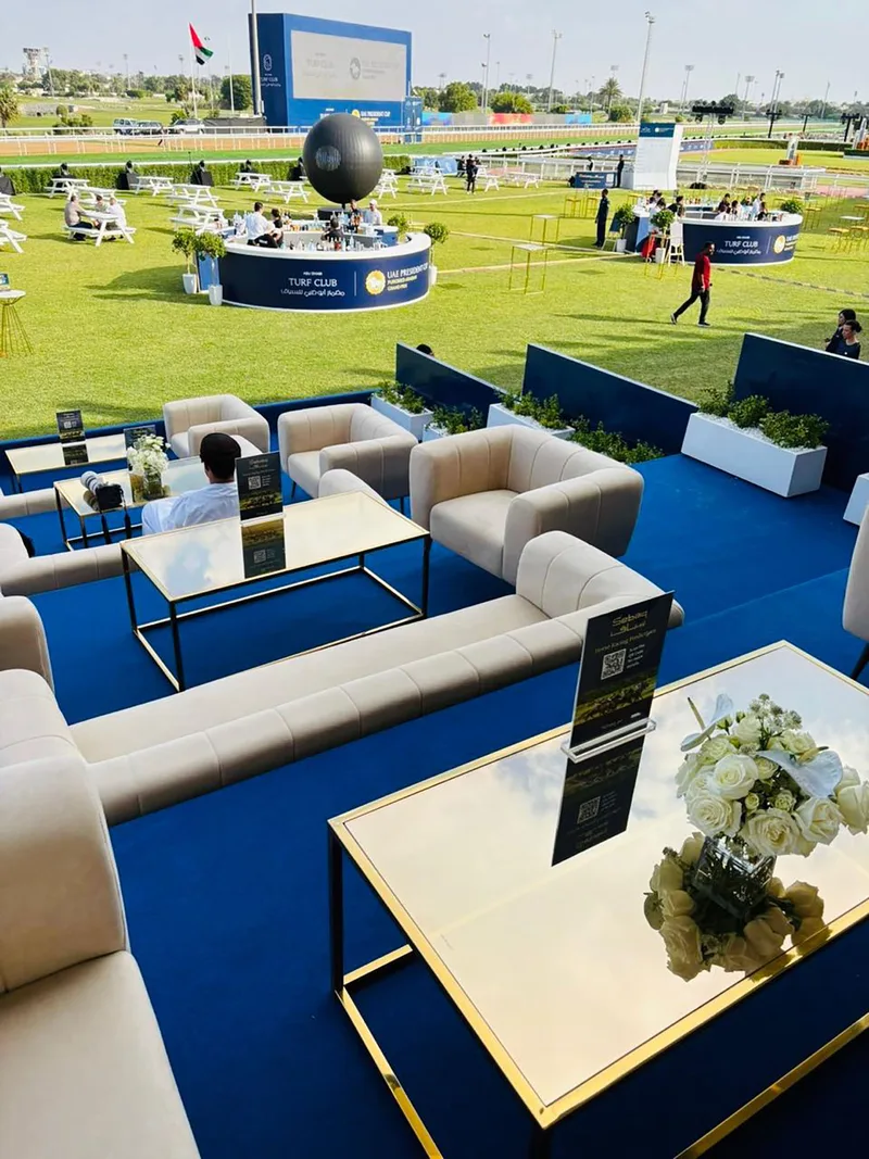 Contemporary coffee tables and luxury sofas supporting refined temporary hospitality spaces.