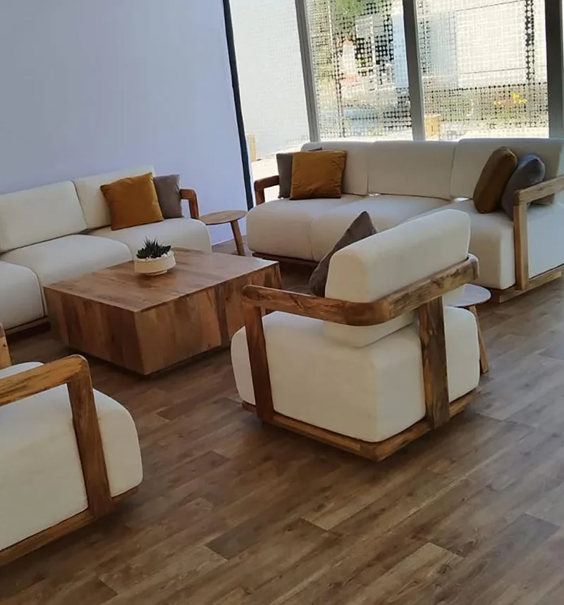 Refined hospitality furniture enhancing temporary lounge environments at Tilal Al Ghaf.