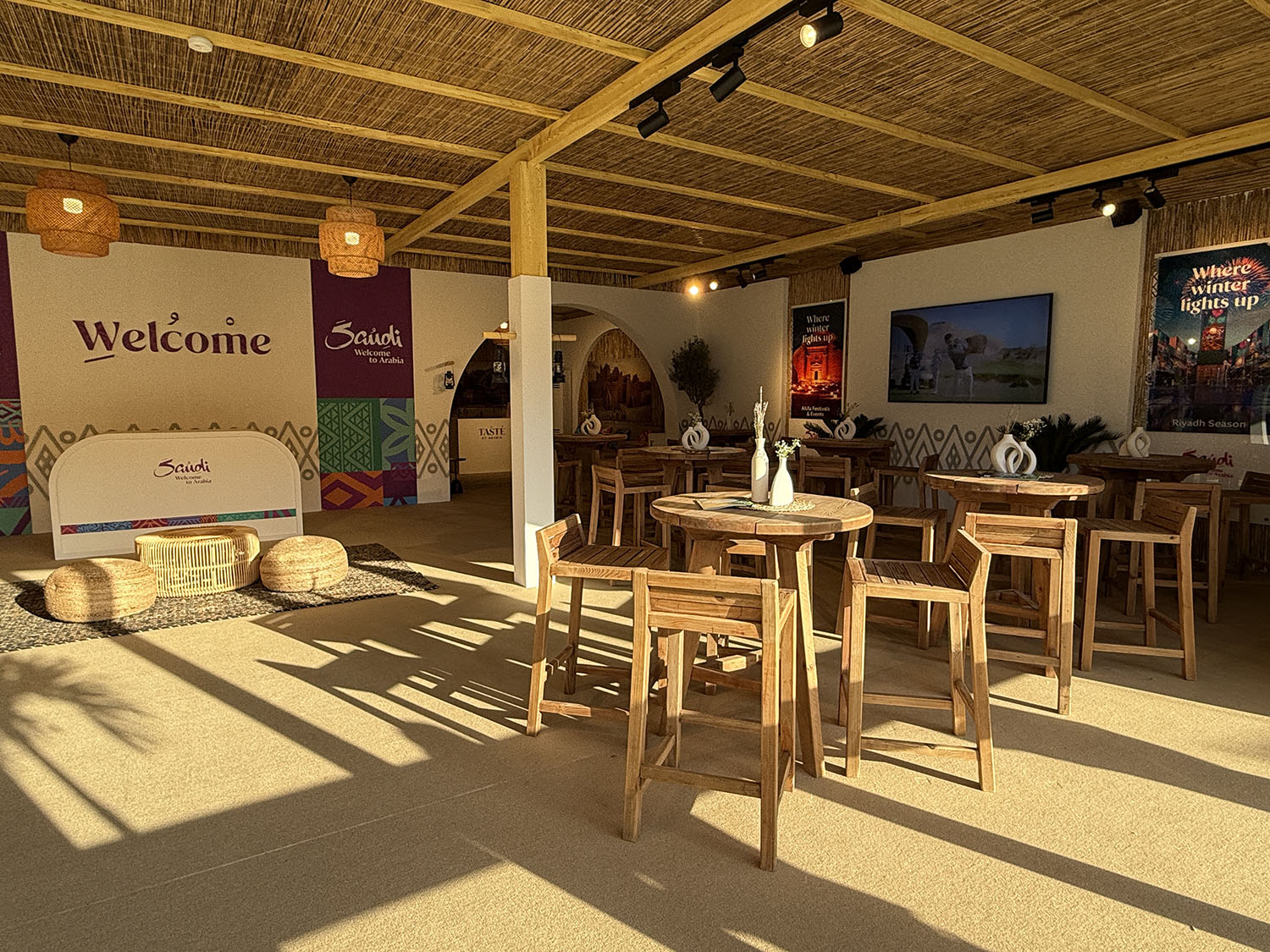 Reception furniture creating a welcoming arrival experience inside the Visit Saudi hospitality tent in Dubai.
